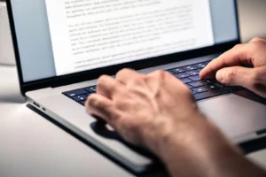 typing on laptop