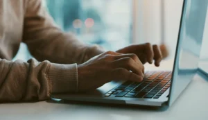 typing on laptop